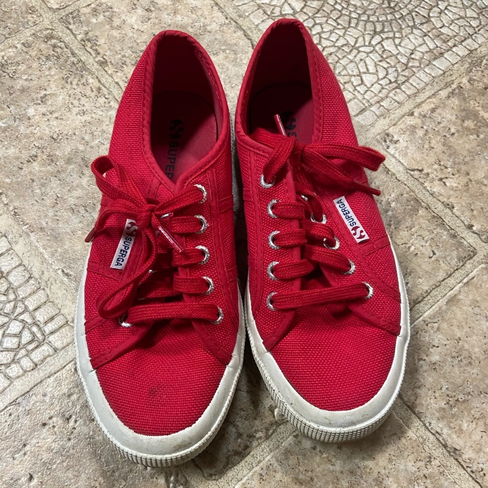 Pair of Red Superga tennis shoes size 6 in great used condition.